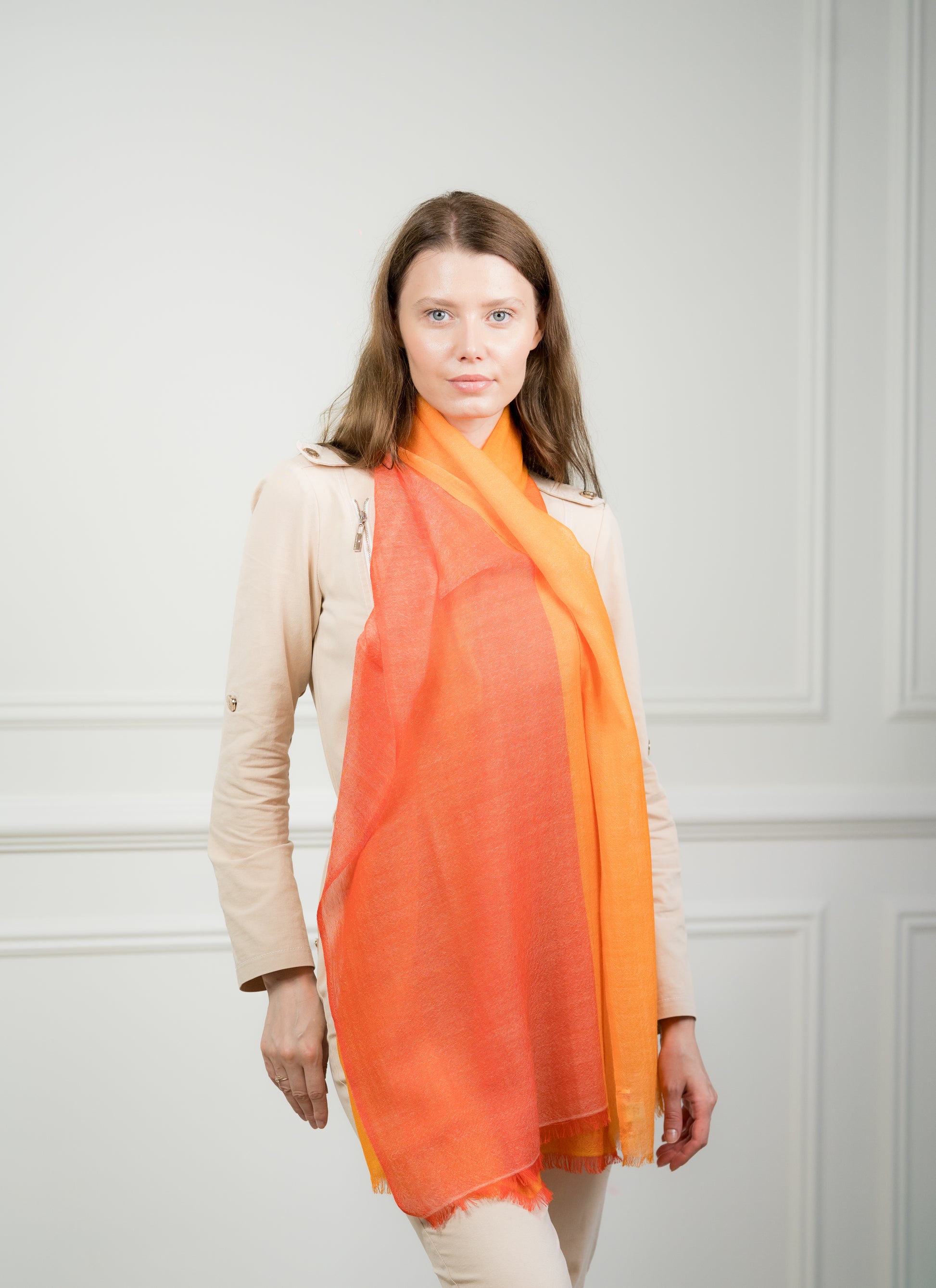 Side profile of a model wearing the 4 Color Block Tangerine Scarf, emphasizing its lightweight design and bold tangerine orange color block.