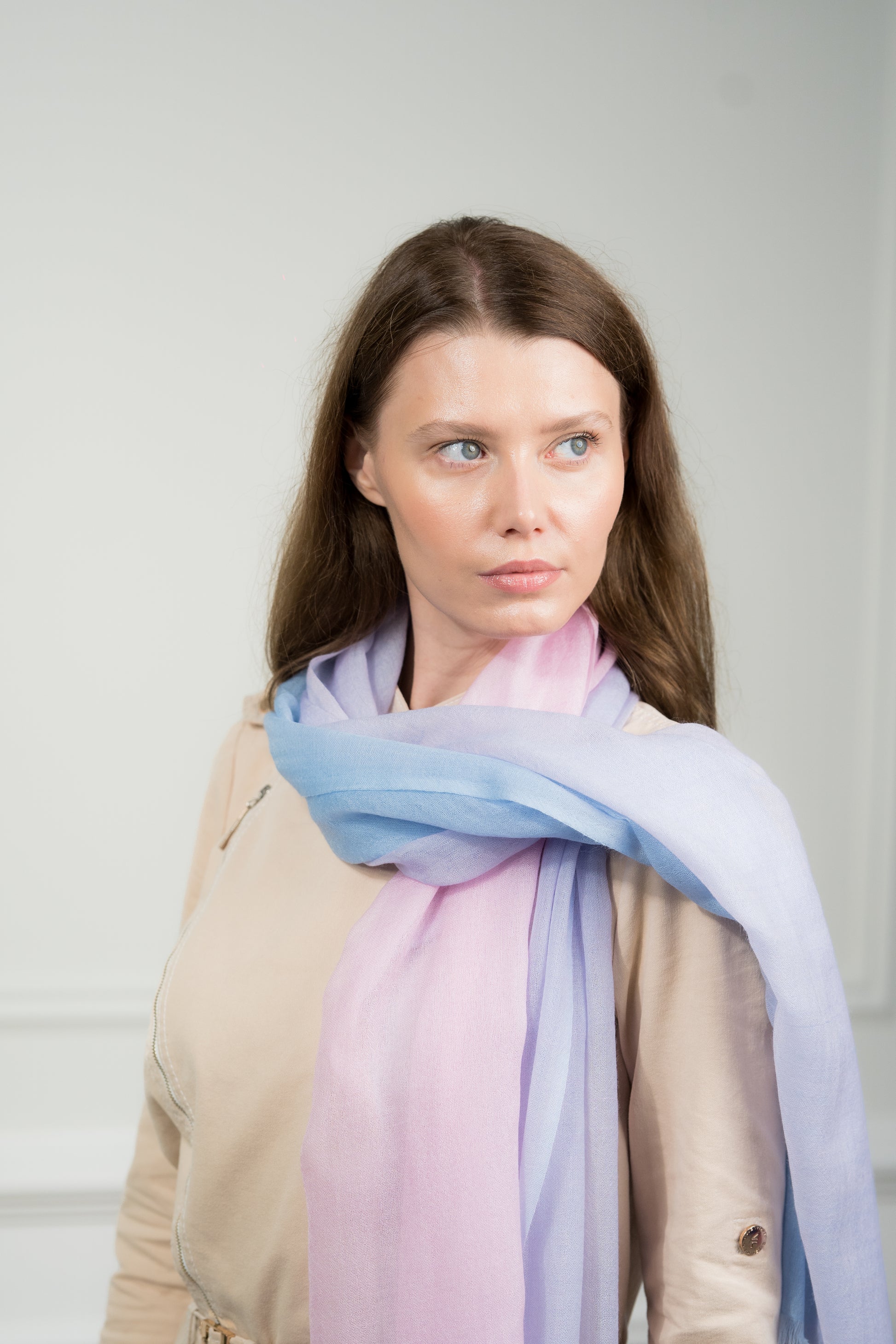 The scarf styled in a loose knot, illustrating its versatility and the interplay of the four color blocks when accessorizing.