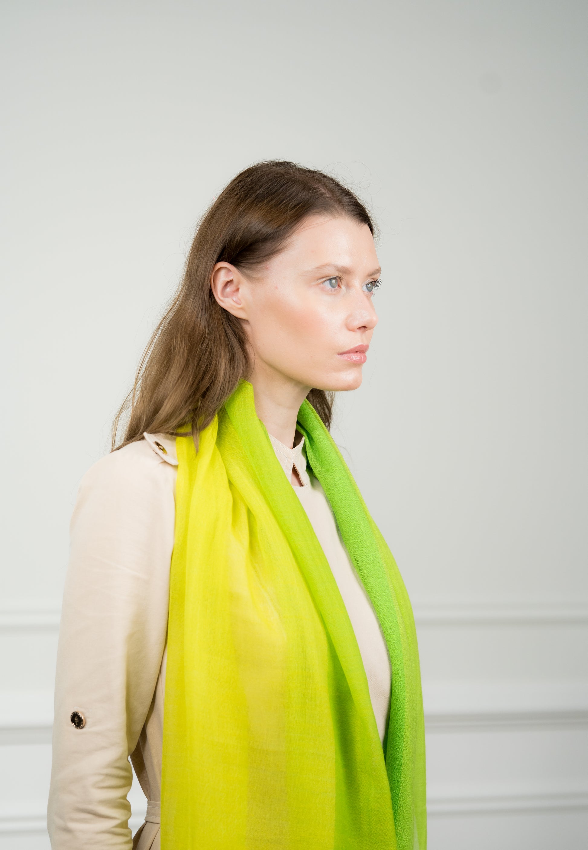 Model draping the lightweight 4 Color Block Chartreuse Scarf over shoulders, highlighting the bold chartreuse and soft beige tones.