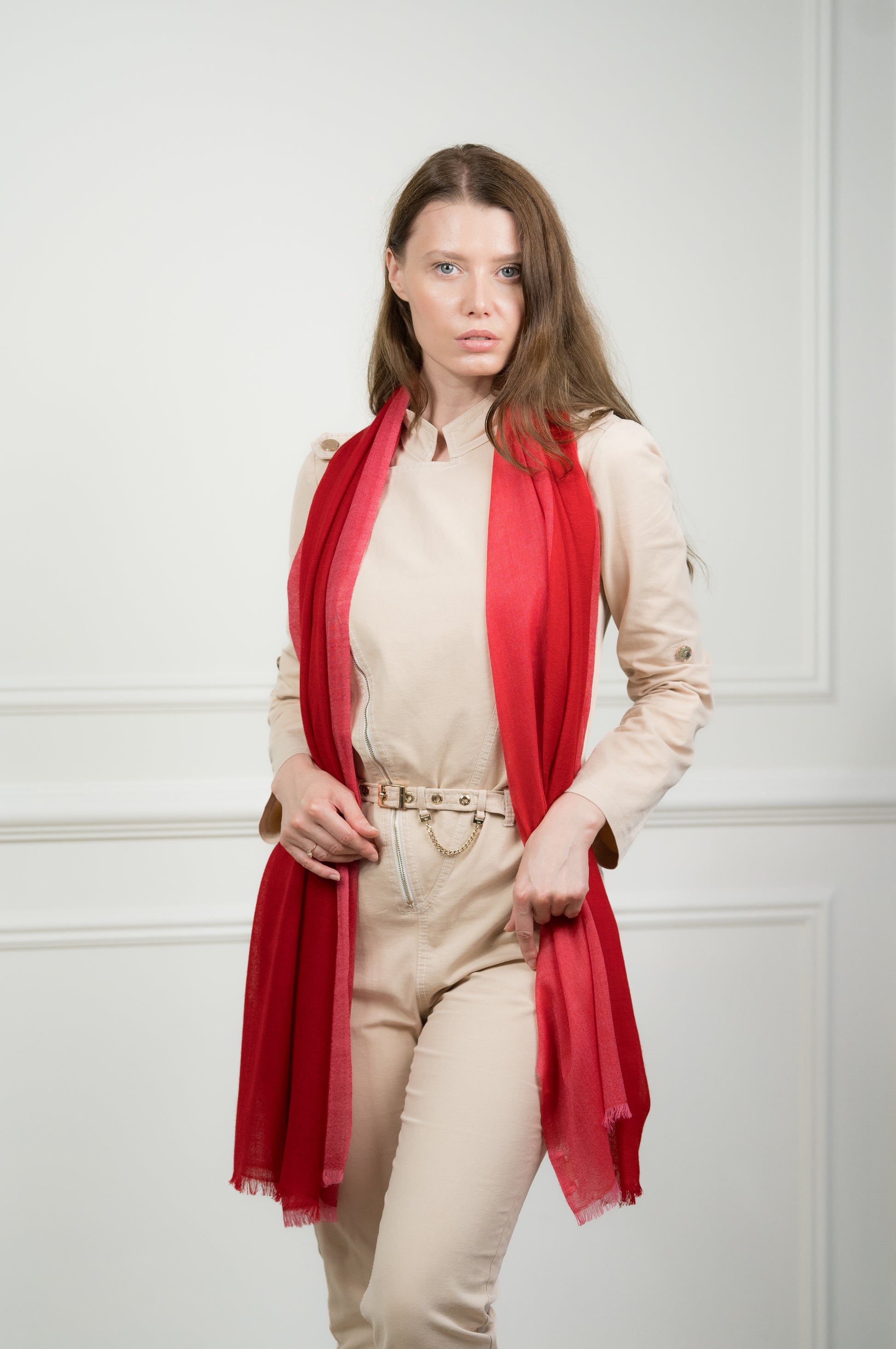 Close-up of the 4 Color Block Scarlet Scarf on a model, highlighting the soft wool texture and transition between scarlet red and gray blocks.