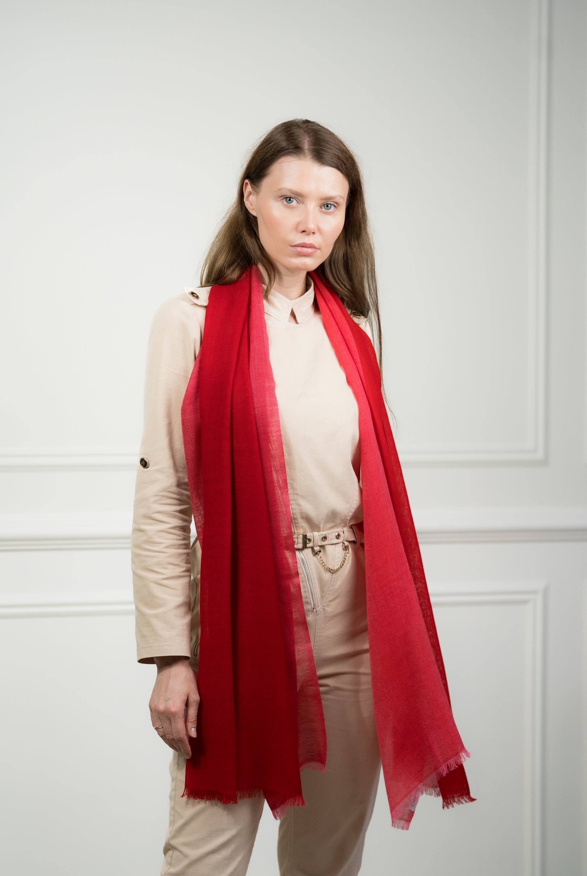 Model draping the 4 Color Block Scarlet Scarf over shoulders, showcasing the interplay of scarlet red, gray, beige, and white color blocks.