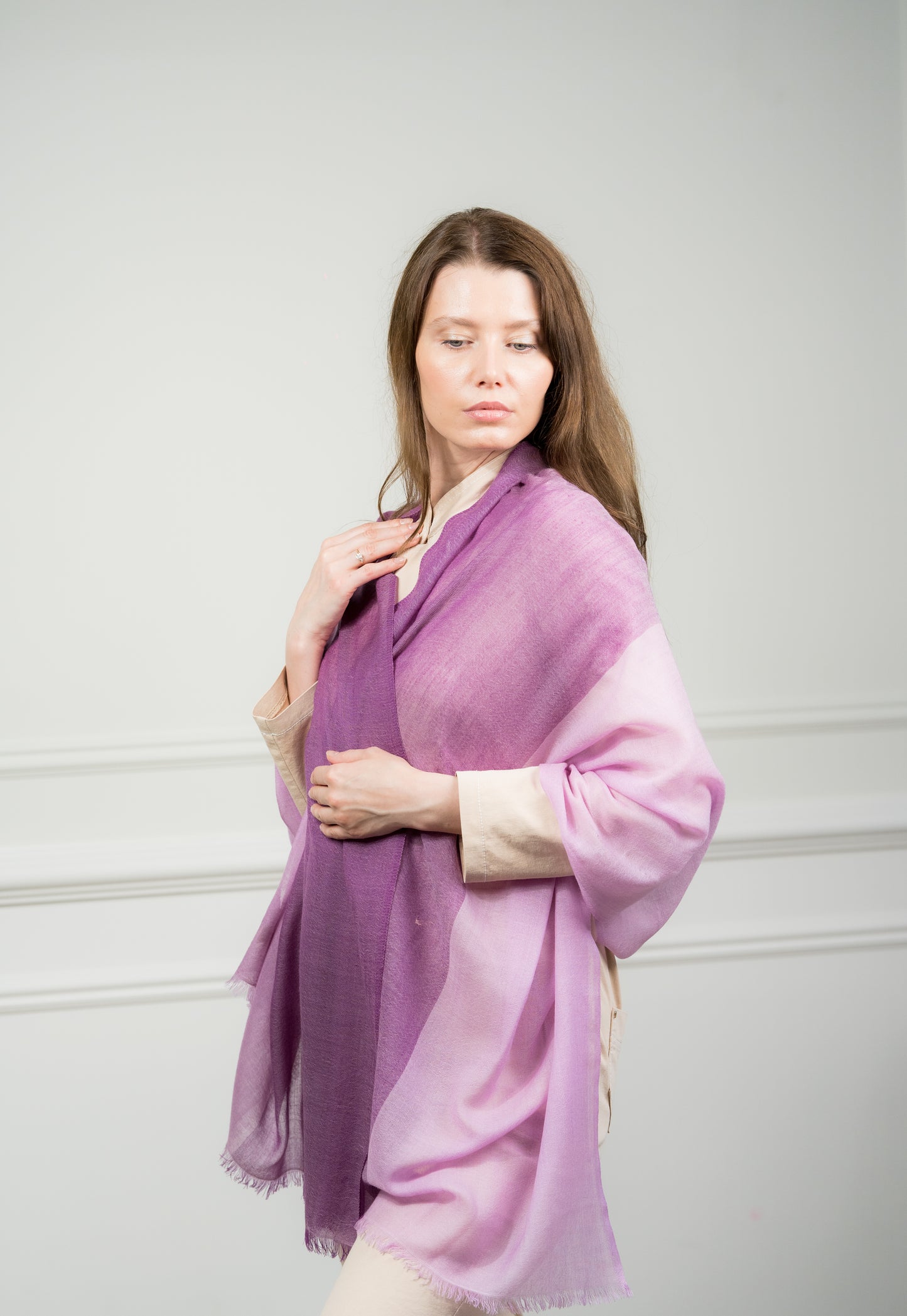 Model draping the 4 Color Block Lilac Scarf, showcasing its lightweight design and vibrant lilac and beige tones with fringed edges.