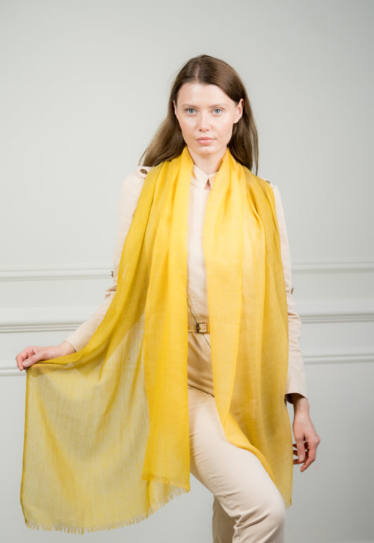 Model wearing Caprus Cashmere's pure wool 4 Color Block Lemon Scarf, featuring vibrant lemon yellow, gray, beige, and white color blocks.
