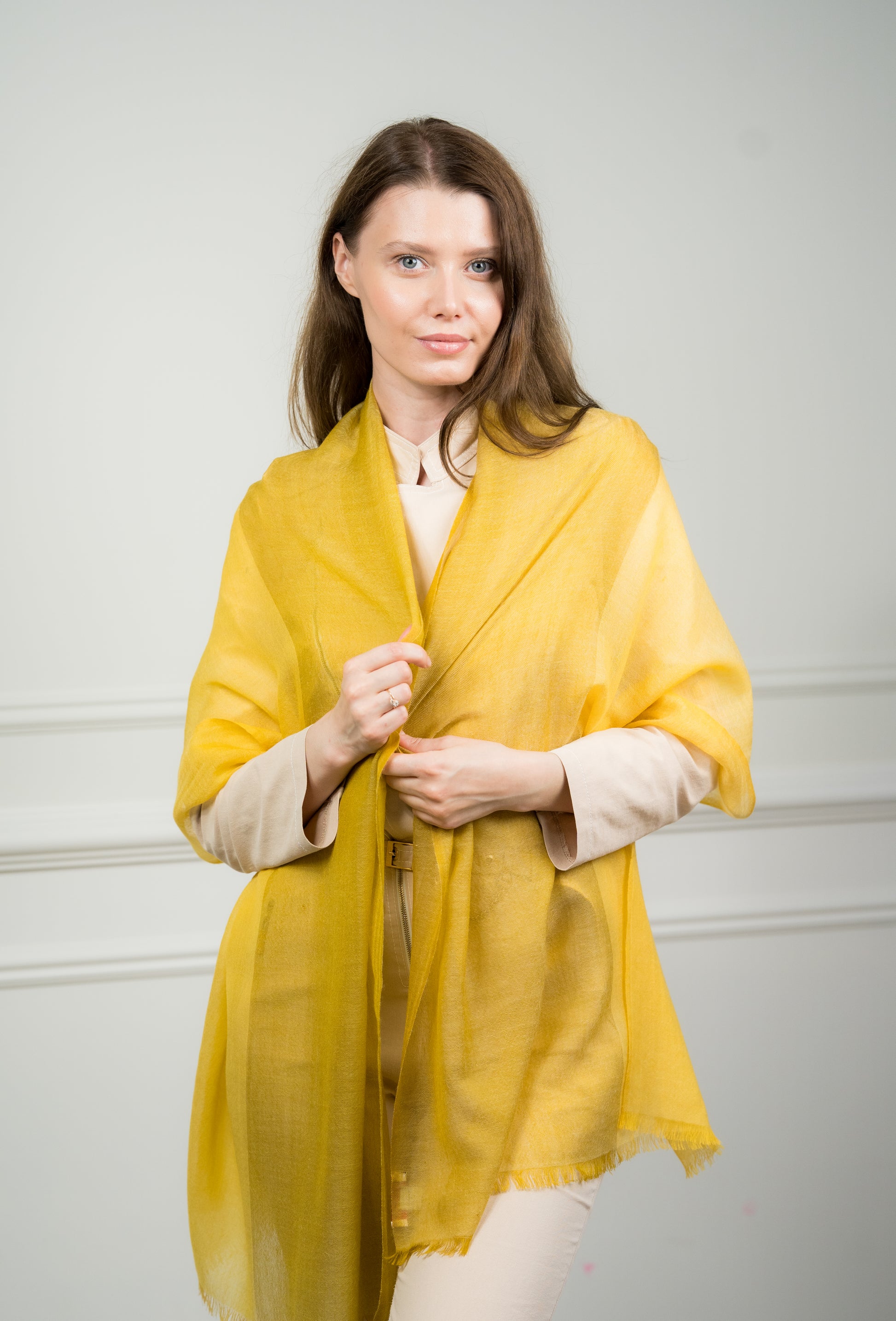 Model draping the 4 Color Block Lemon Scarf over shoulders, showcasing the interplay of lemon yellow, gray, beige, and white color blocks.