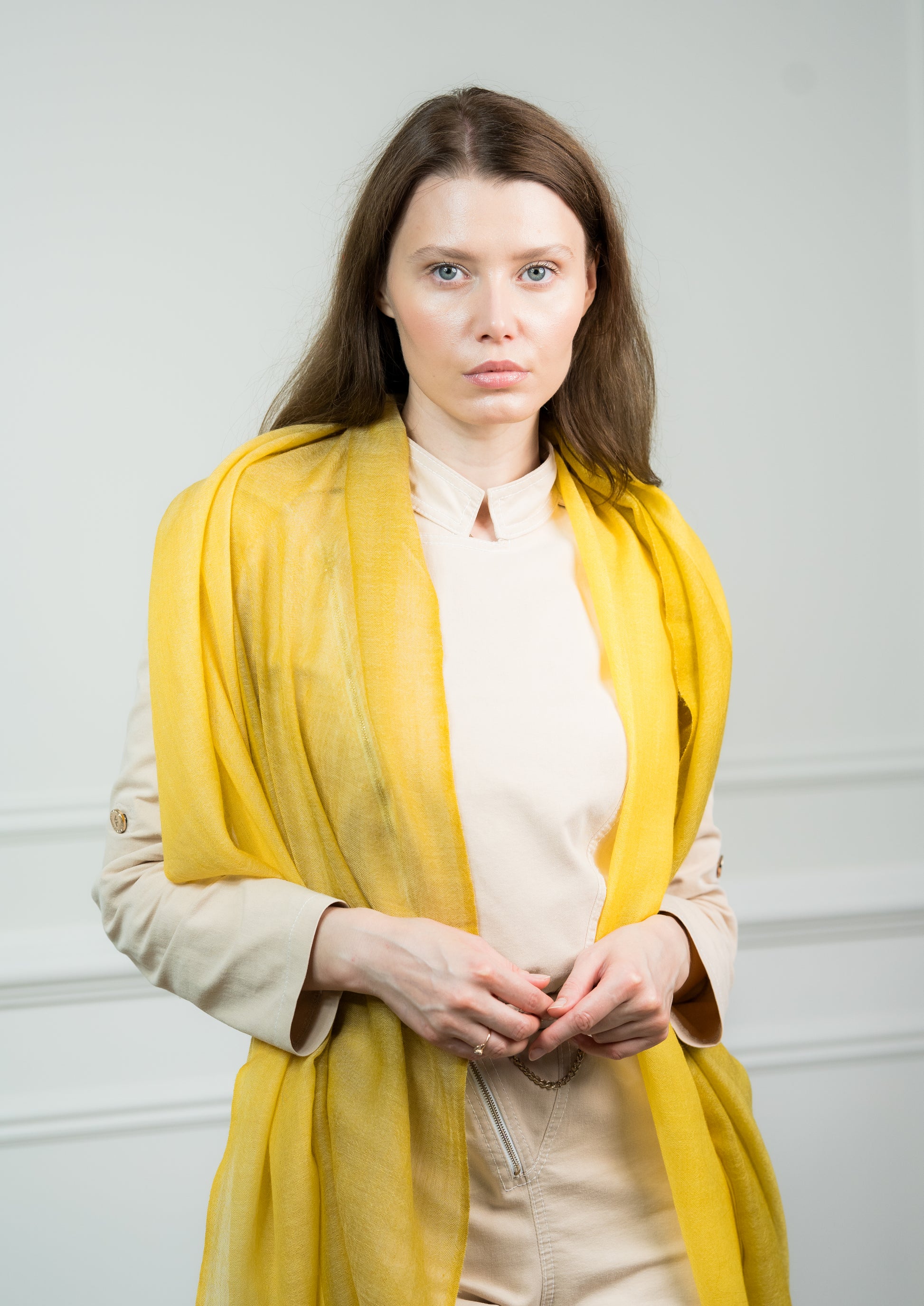 Pure wool 4 Color Block Lemon Scarf styled in a loose knot on a model, displaying the vibrant lemon yellow and beige sections with fringed edges.