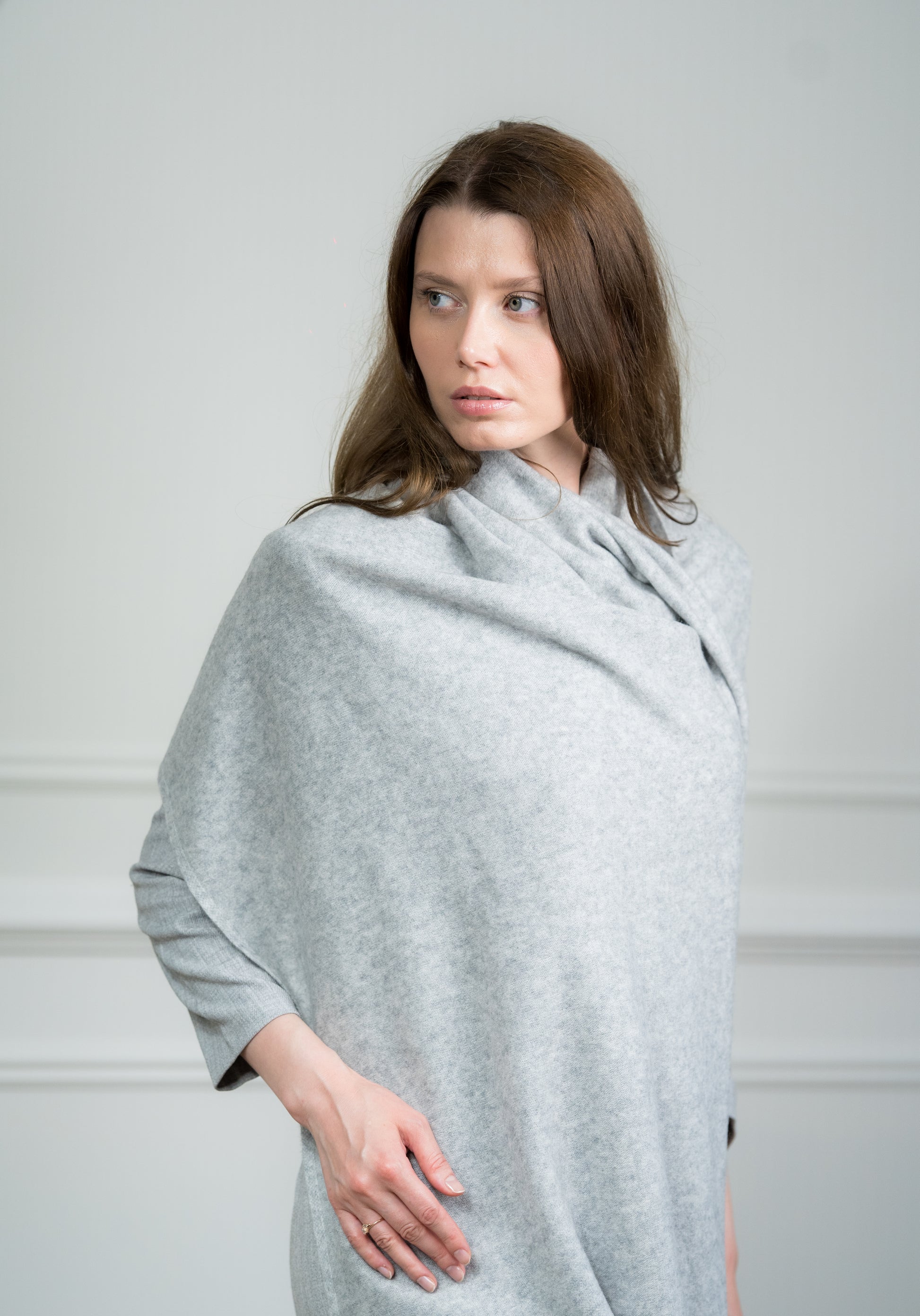 Detailed view of the Silver Travel Wrap's fringed edges, emphasizing Caprus Cashmere's craftsmanship and attention to detail.