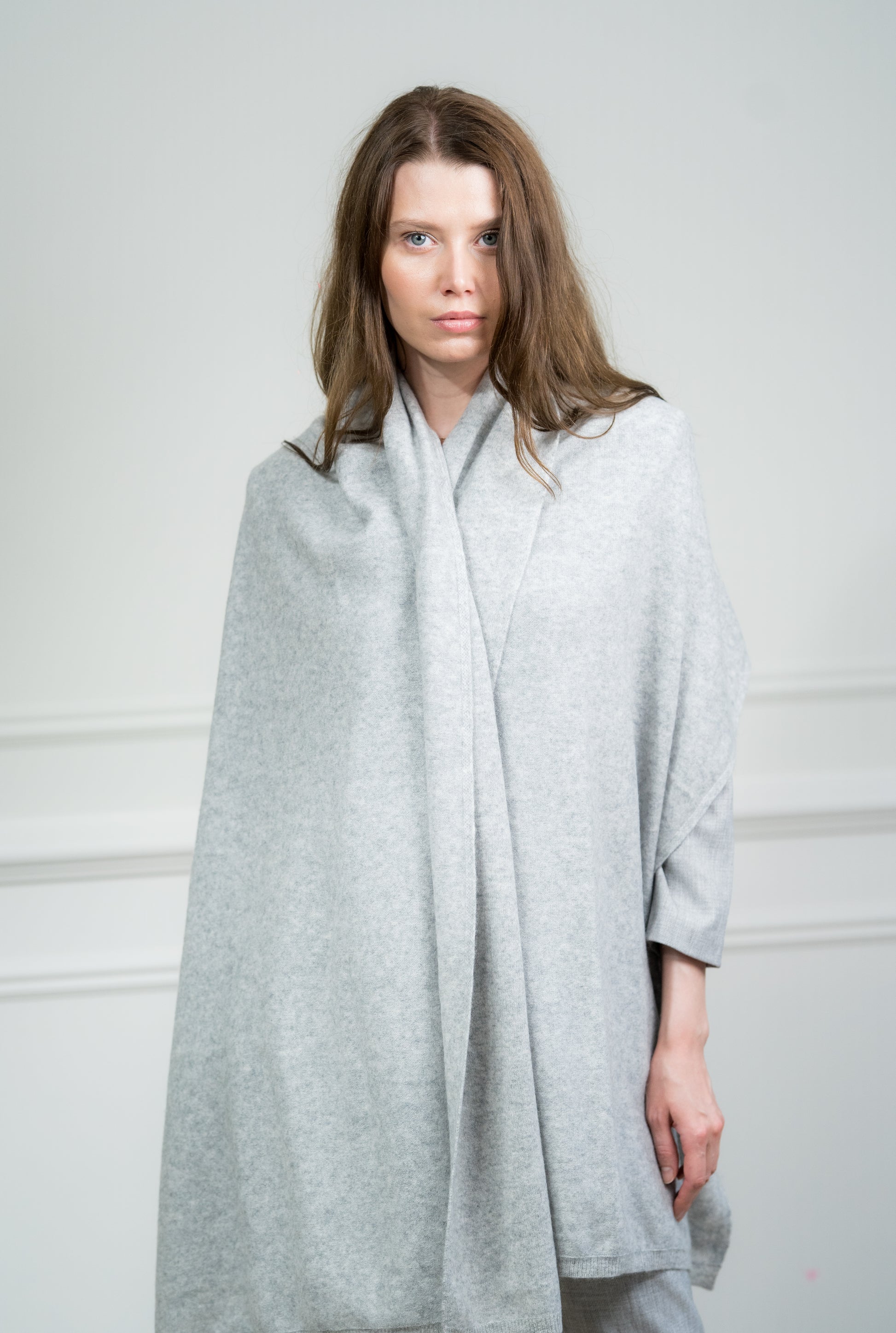 Close-up of the Silver Travel Wrap, highlighting the fine knit and luxurious feel of the pure cashmere material.