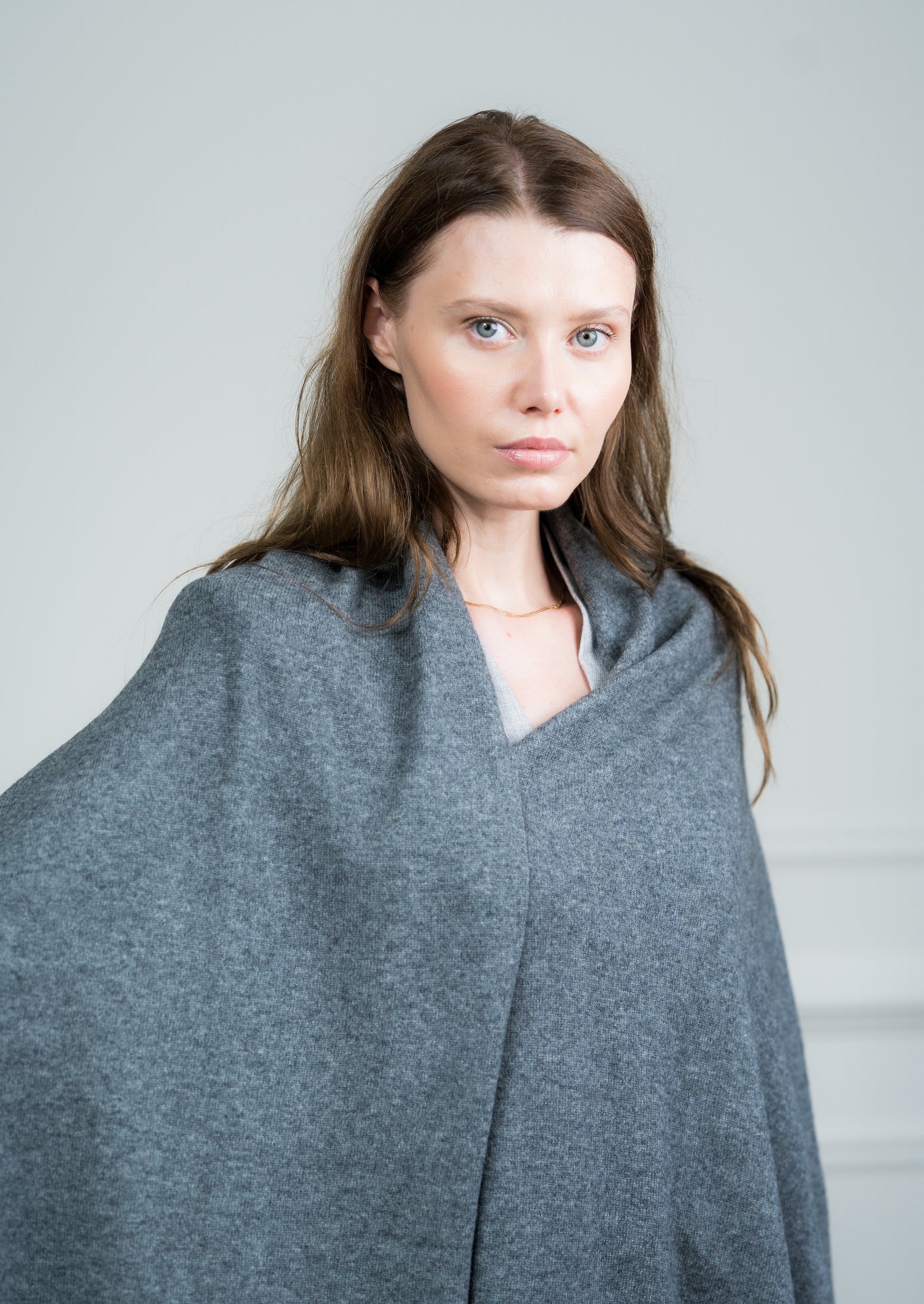 Detailed view of the Charcoal Travel Wrap's fringed edges, emphasizing Caprus Cashmere's craftsmanship and attention to detail.