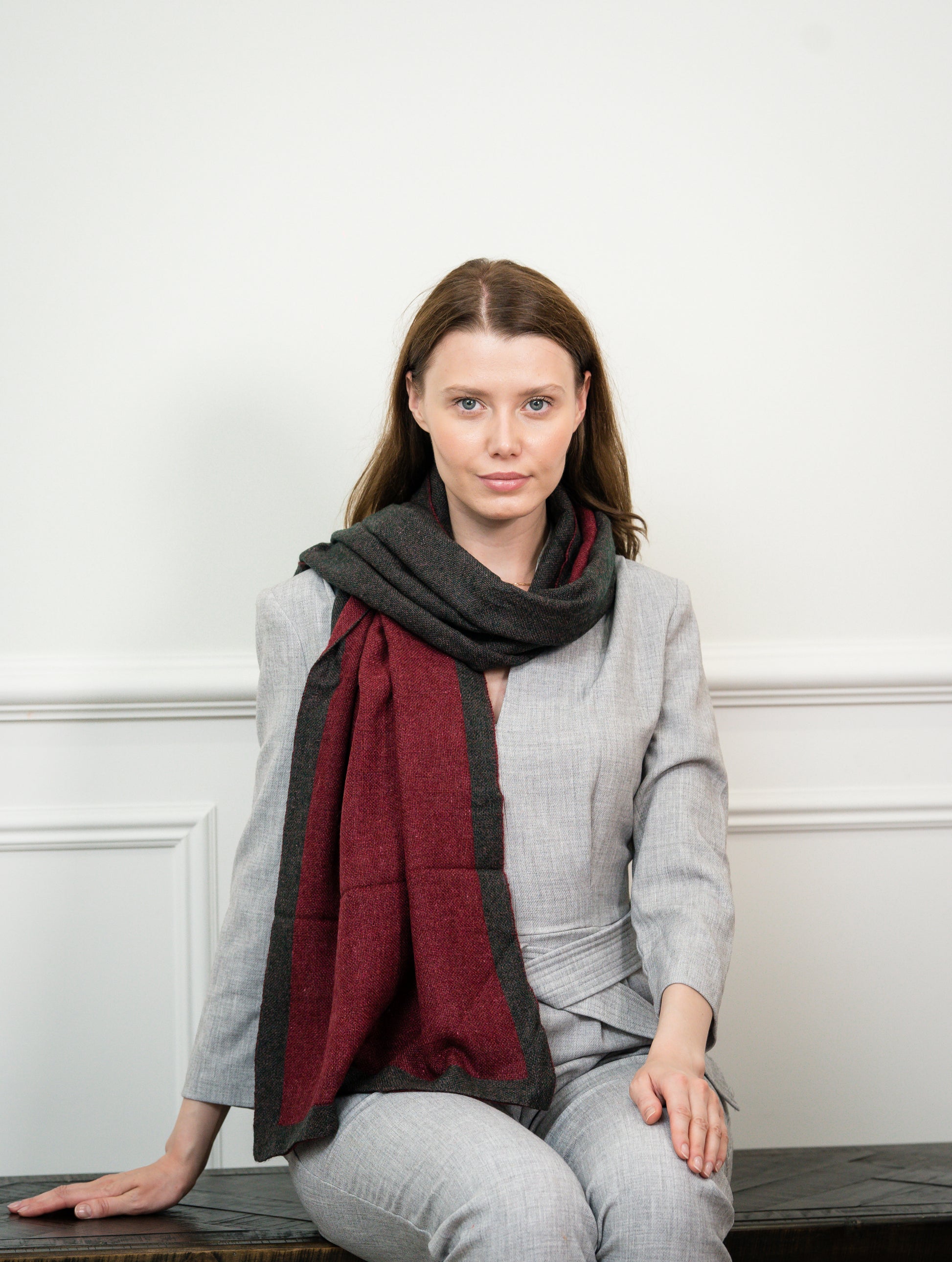 Caprus Cashmere's Ristic Red Two Tone Scarf displayed flat, showcasing its vibrant red and khaki color combination, perfect for adding a bold accent to any outfit.