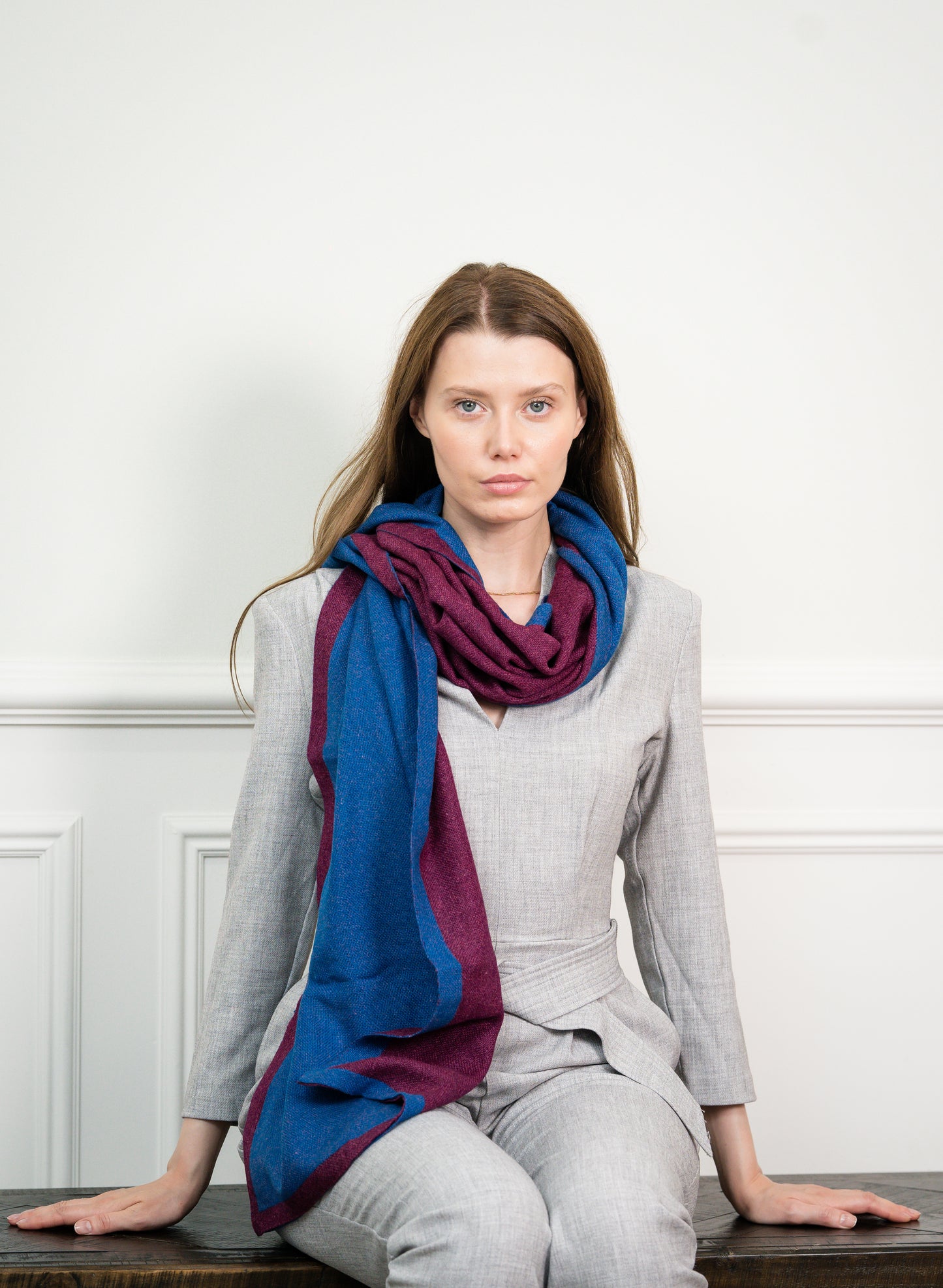 Close-up of the Blue Wine Two Tone Scarf on a model, highlighting the soft cashmere texture and seamless transition between blue and wine colors.