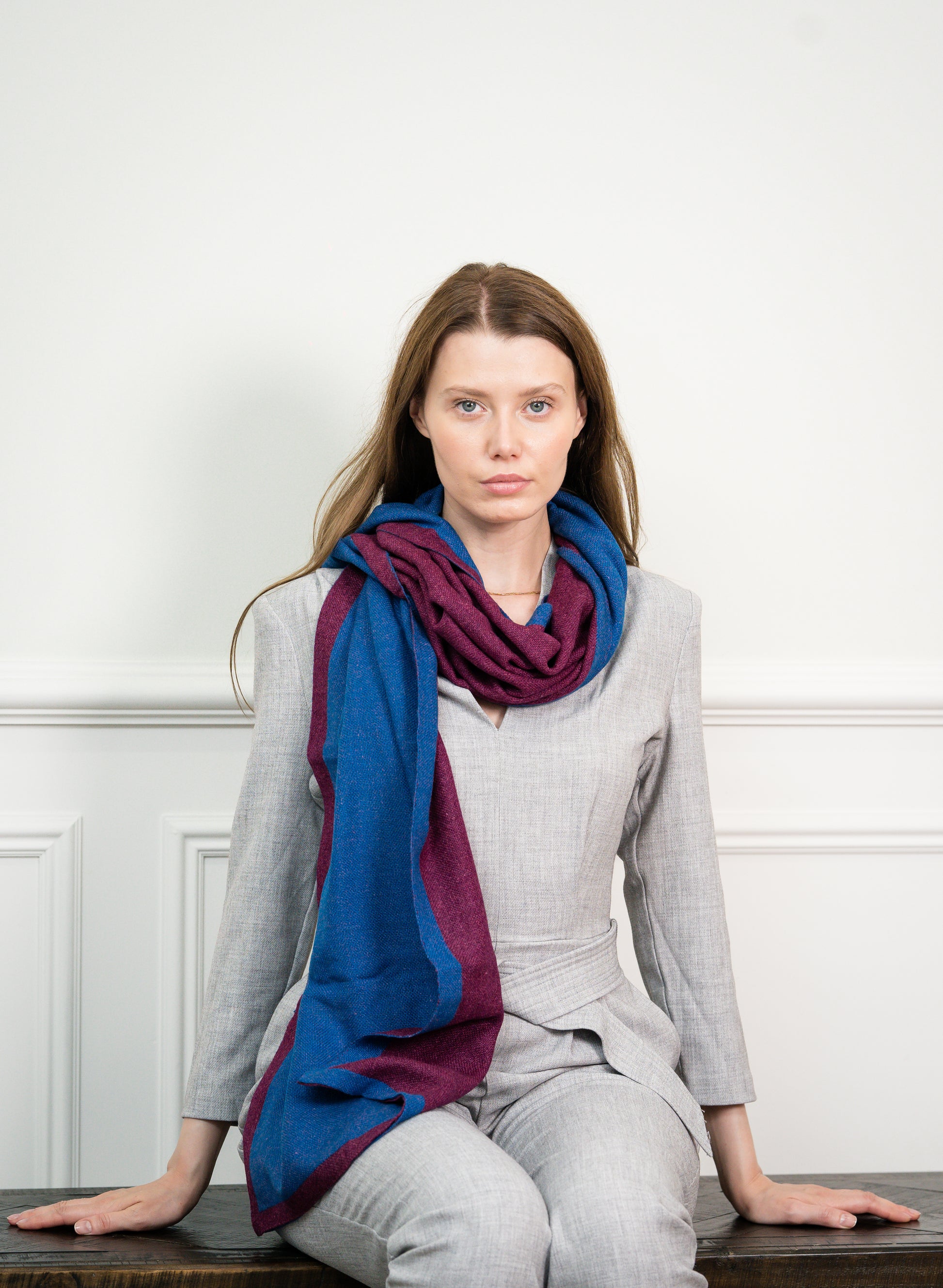 Close-up of the Blue Wine Two Tone Scarf on a model, highlighting the soft cashmere texture and seamless transition between blue and wine colors.