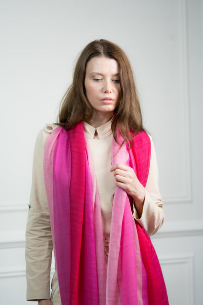 Model draping the Herringbone Rosy Four Color Block Scarf over shoulders, showcasing its versatility as a women's scarf and travel wrap.