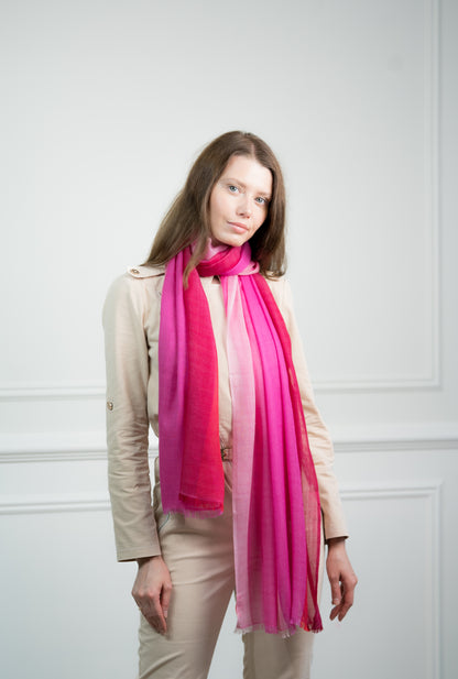 Model styling the Herringbone Rosy Four Color Block Scarf in a loose knot, perfect as a luxurious women's accessory and thoughtful gift.