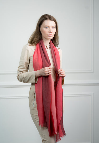 Close-up of the Herringbone Ruby Four Color Block Scarf on a model, highlighting the soft cashmere texture and intricate herringbone pattern.