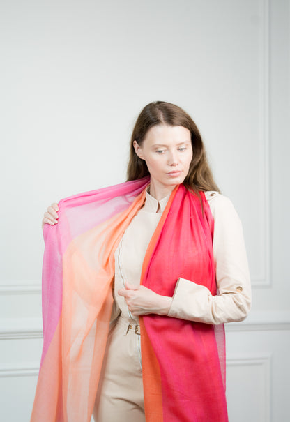 Pure wool 4 Color Block Candy Scarf styled in a loose knot on a model, showing off its bold pink and blue blocks with fringed edges.