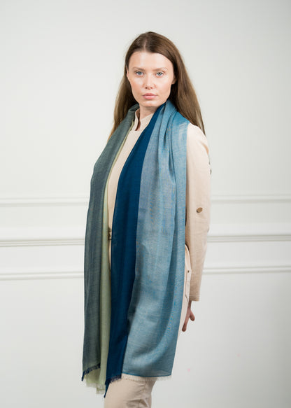 Close-up of the 4 Color Block Jade Scarf on a model, highlighting the premium wool texture and transition between jade green and gray blocks.