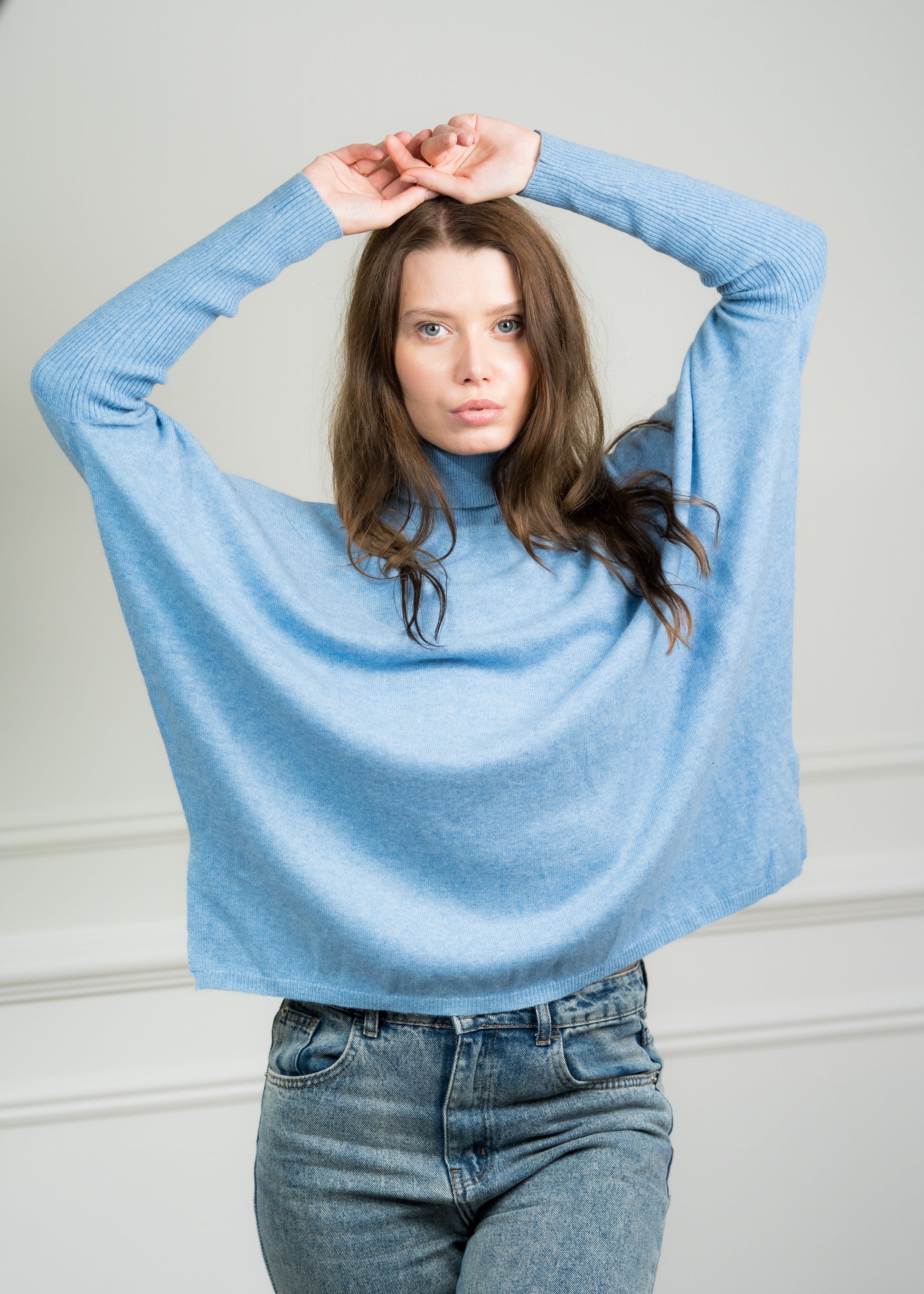 Close-up of the Sky Boxy Sweater on a model, highlighting the fine cashmere knit and ribbed detailing on the cuffs and hem.