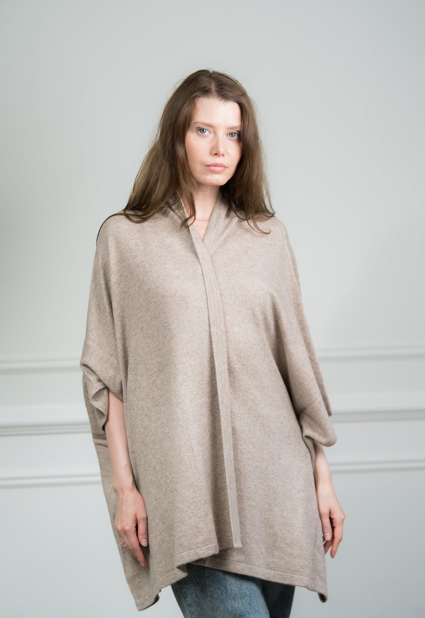 Model styling the Taupe Cashmere Kimono as a women's wrap, demonstrating its versatility as a travel accessory and thoughtful gift for special occasions.