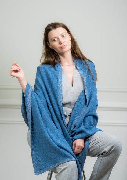 Close-up of the Sky Pointelle Wrap on a model, highlighting the fine cashmere knit and delicate pointelle detailing.