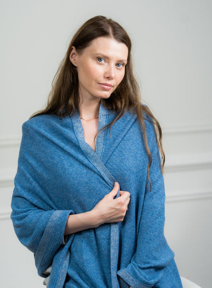 Detailed view of the Sky Pointelle Wrap's fringed edges, emphasizing Caprus Cashmere's craftsmanship and suitability for gifting.