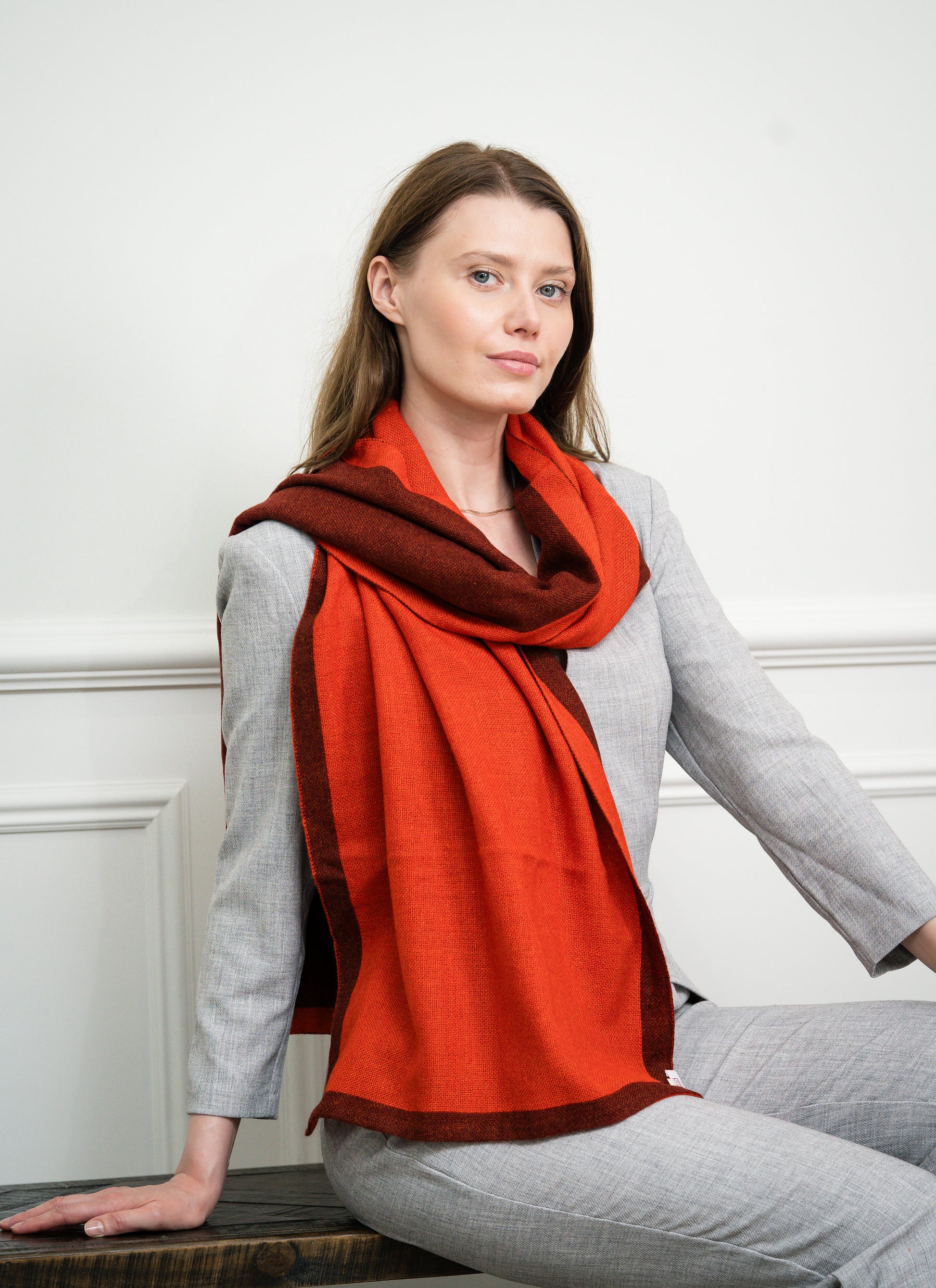 Close-up of the Burgundy Two Tone Scarf on a model, highlighting the soft cashmere texture and seamless transition between burgundy and the secondary color.